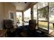 Enjoy outdoor living on this screened patio with comfortable seating and views of the backyard at 7882 Dulce Ave, North Port, FL 34287