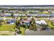 Lovely aerial view showcases waterfront homes along canals, featuring lush tropical landscaping and water views at 82 Caddy Rd, Rotonda West, FL 33947