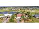 Light blue single-story home near a golf course and pond at 82 Caddy Rd, Rotonda West, FL 33947