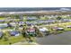 Beautiful aerial view showcases waterfront homes along canals with lush tropical landscaping at 82 Caddy Rd, Rotonda West, FL 33947