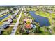 Aerial view of the property, showcasing pool and proximity to waterways and golf course at 82 Caddy Rd, Rotonda West, FL 33947