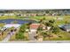 Beautiful view of the home with a lush garden and golf course view at 82 Caddy Rd, Rotonda West, FL 33947