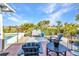 Inviting backyard with manicured landscaping, cozy seating, and a charming water feature, creating a relaxing outdoor oasis at 82 Caddy Rd, Rotonda West, FL 33947