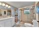 Beautiful bathroom with a glass shower, vanity with sink, and a toilet at 82 Caddy Rd, Rotonda West, FL 33947