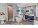 Stylish bathroom featuring a modern tub, a walk-in shower with glass doors, and a sleek vanity at 82 Caddy Rd, Rotonda West, FL 33947