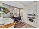 Well-lit bathroom with a modern vanity, a soaking tub, and decorative shelving for storage at 82 Caddy Rd, Rotonda West, FL 33947