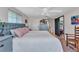 Comfortable bedroom featuring an upholstered headboard and a view of a beachy painting at 82 Caddy Rd, Rotonda West, FL 33947