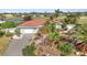 Well-maintained home with charming curb appeal and a lush, landscaped front yard at 82 Caddy Rd, Rotonda West, FL 33947