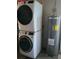 The laundry area shows a stacked washer and dryer set, along with a hot water heater at 82 Caddy Rd, Rotonda West, FL 33947
