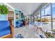 Enclosed patio features nice tile, comfortable furniture and view to the pool at 82 Caddy Rd, Rotonda West, FL 33947