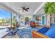 Spacious sunroom with tile floors, natural light, and comfortable seating, creating a cozy and inviting space at 82 Caddy Rd, Rotonda West, FL 33947