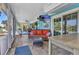 Bright sunroom with tile flooring, comfortable seating, and access to outdoor spaces, perfect for relaxation and entertaining at 82 Caddy Rd, Rotonda West, FL 33947