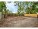 Large, partially fenced backyard offering ample space for various outdoor activities and landscaping opportunities at 8706 Fish Lake Rd, Tampa, FL 33619