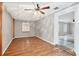 Inviting bedroom features wood look floors and is conveniently located near an adjacent room at 8706 Fish Lake Rd, Tampa, FL 33619