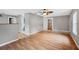 Open dining room with hardwood floors, decorative lighting, and sliding glass doors at 8706 Fish Lake Rd, Tampa, FL 33619