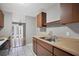 Well-lit kitchen area featuring a stainless steel sink, wood countertops, and tile flooring at 8706 Fish Lake Rd, Tampa, FL 33619