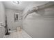Utility room with a tile floor, some shelves, and hookups for laundry appliances at 8706 Fish Lake Rd, Tampa, FL 33619