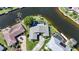 Overhead view of a home with boat dock, pool, and canal front location at 955 Don Juan Ct, Punta Gorda, FL 33950