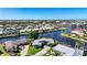 Panoramic view of a neighborhood with beautiful waterfront homes and access to the bay at 955 Don Juan Ct, Punta Gorda, FL 33950
