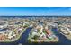 High aerial view of waterfront homes and neighborhood at 955 Don Juan Ct, Punta Gorda, FL 33950