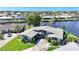 Stunning aerial view of a waterfront property with beautiful landscaping and boat access at 955 Don Juan Ct, Punta Gorda, FL 33950