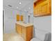 Bathroom featuring a large mirror, wood cabinetry, and toilet at 955 Don Juan Ct, Punta Gorda, FL 33950