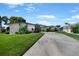 Contemporary home exterior with manicured lawn and elegant landscaping at 955 Don Juan Ct, Punta Gorda, FL 33950