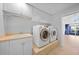 Laundry room features a sink and new front loading washer and dryer at 955 Don Juan Ct, Punta Gorda, FL 33950