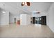 A spacious living area featuring access to both the kitchen and the outdoor lanai at 955 Don Juan Ct, Punta Gorda, FL 33950