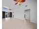 The open-concept living space features tile floors, sliders to the lanai, and access to the kitchen at 955 Don Juan Ct, Punta Gorda, FL 33950