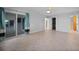 Spacious main bedroom boasts tile floors, a ceiling fan, walk-in closet and exterior access at 955 Don Juan Ct, Punta Gorda, FL 33950