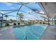 Enjoy the refreshing enclosed pool with views of the canal and the outdoors at 955 Don Juan Ct, Punta Gorda, FL 33950