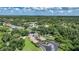 Aerial view of Harbour Oaks community entrance and lush surrounding landscaping at 1065 Harbour Glen Pl, Punta Gorda, FL 33983