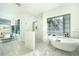 Bright, modern bathroom with soaking tub and stand up shower at 1065 Harbour Glen Pl, Punta Gorda, FL 33983