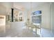 Elegant dining room with a glass table, chandelier, and bright natural light at 1065 Harbour Glen Pl, Punta Gorda, FL 33983