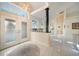 Grand foyer with high ceilings, elegant chandelier, and white tile flooring at 1065 Harbour Glen Pl, Punta Gorda, FL 33983