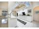 Bright white kitchen featuring a unique ceiling design and sleek appliances at 1065 Harbour Glen Pl, Punta Gorda, FL 33983