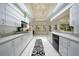 Bright, white kitchen with stainless steel appliances and large windows at 1065 Harbour Glen Pl, Punta Gorda, FL 33983