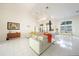 Open-concept living area with modern decor, high ceilings, and abundant natural light at 1065 Harbour Glen Pl, Punta Gorda, FL 33983