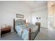 Vaulted primary bedroom with carpet and king bed at 1065 Harbour Glen Pl, Punta Gorda, FL 33983