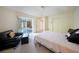 Bedroom featuring patio access, large closet and sitting area at 1065 Harbour Glen Pl, Punta Gorda, FL 33983
