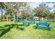 A view of the playground and picnic tables on a grassy lawn at 1065 Harbour Glen Pl, Punta Gorda, FL 33983
