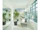 Bright sitting area features tile floors, glass block window, and mirrored walls at 1065 Harbour Glen Pl, Punta Gorda, FL 33983