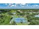 Aerial view of well maintained tennis courts in the Harbour Oaks community at 1065 Harbour Glen Pl, Punta Gorda, FL 33983