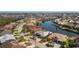 Charming waterfront home boasts a screened lanai and private dock with direct water access at 1311 Pine Siskin Dr, Punta Gorda, FL 33950