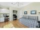 Cozy bedroom includes built-in desk area, closet, and a daybed, maximizing space and functionality at 1311 Pine Siskin Dr, Punta Gorda, FL 33950