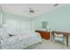 Bedroom with a queen bed, ceiling fan, a dresser and a side table with lamp at 1311 Pine Siskin Dr, Punta Gorda, FL 33950