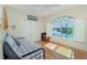Bright bedroom features lovely water views from the unique window, adding charm and natural light at 1311 Pine Siskin Dr, Punta Gorda, FL 33950