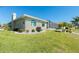 The backyard boasts lush landscaping, a screened-in lanai and plenty of green space at 1311 Pine Siskin Dr, Punta Gorda, FL 33950