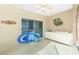 Spacious lanai with a ceiling fan, furniture, and access to the backyard, with decor at 1311 Pine Siskin Dr, Punta Gorda, FL 33950